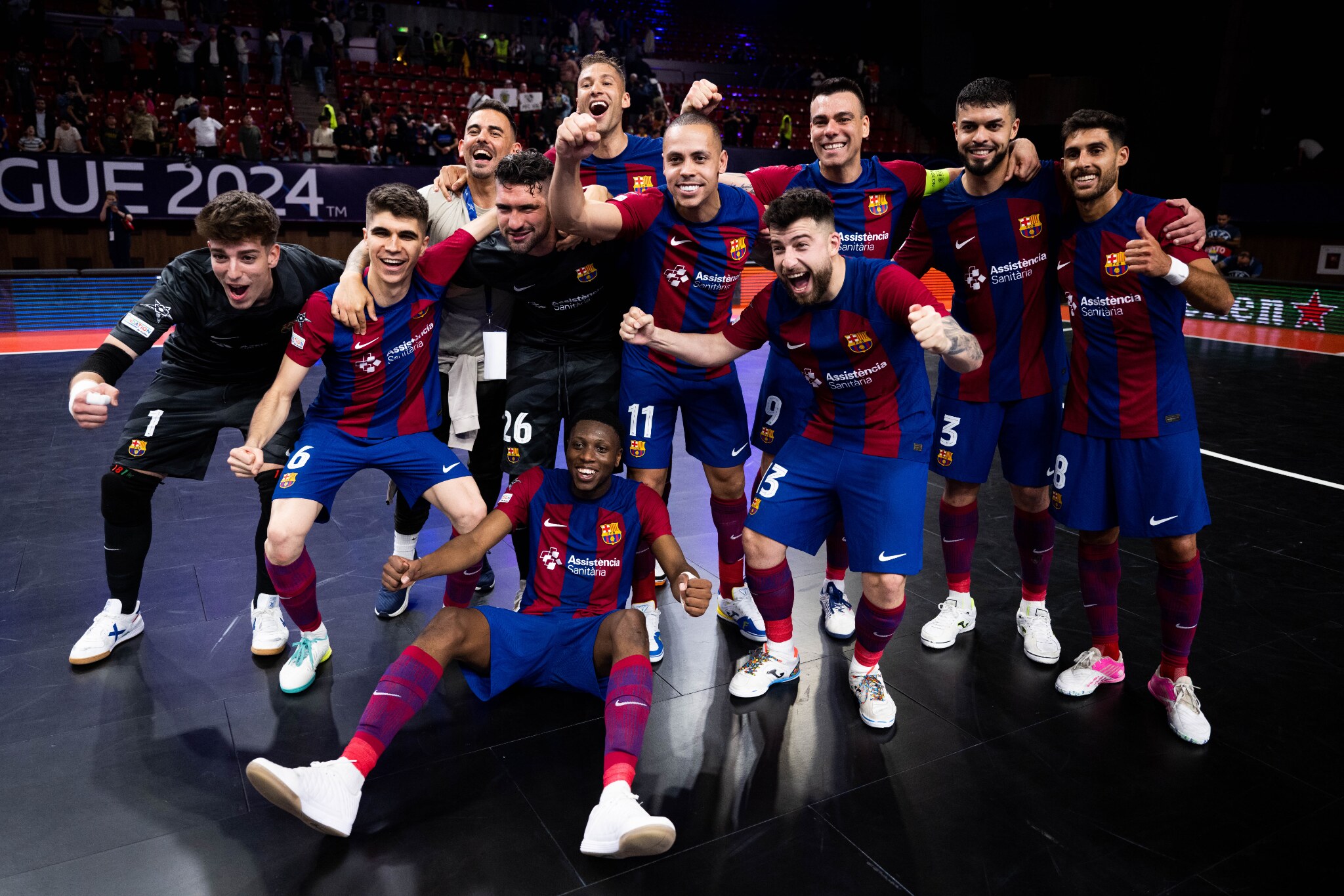 FC Barcelona futsal players celebrating together